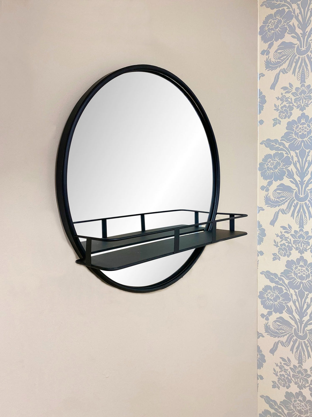 Circular Black Metal Framed Mirror With Shelf